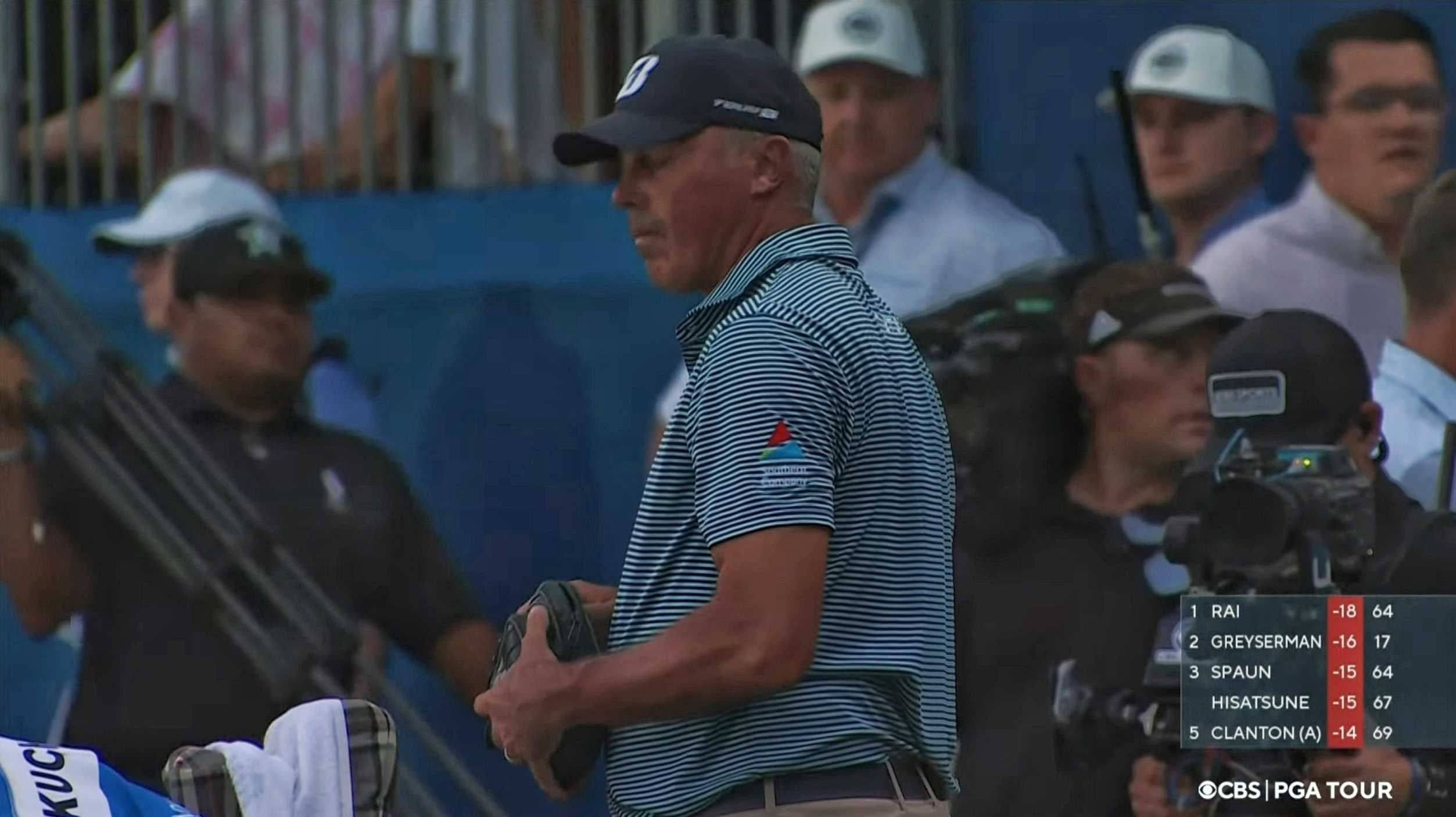 Matt Kuchar behind the 18th green on Sunday night, having decided not to play anymore