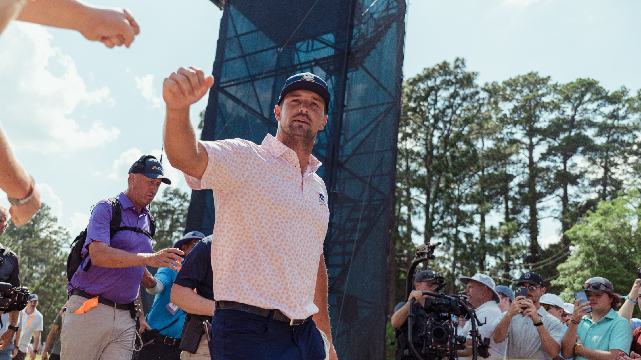 Bryson DeChambeau fist bumps fans at the 2024 U.S. Open at Pinehurst No. 2