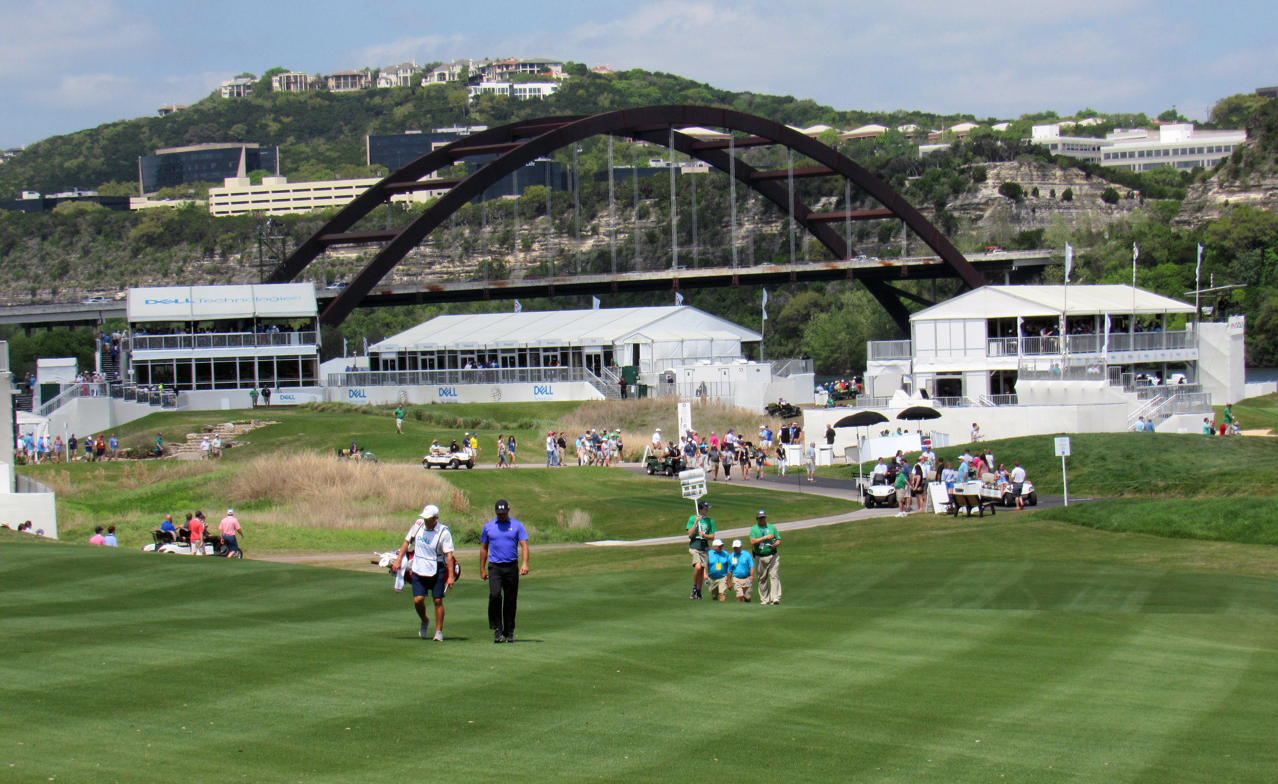 Gary Woodland walks up the 16th hole at Austin Country Club