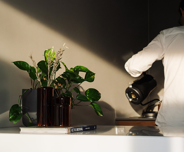 Man pouring from a teapot.