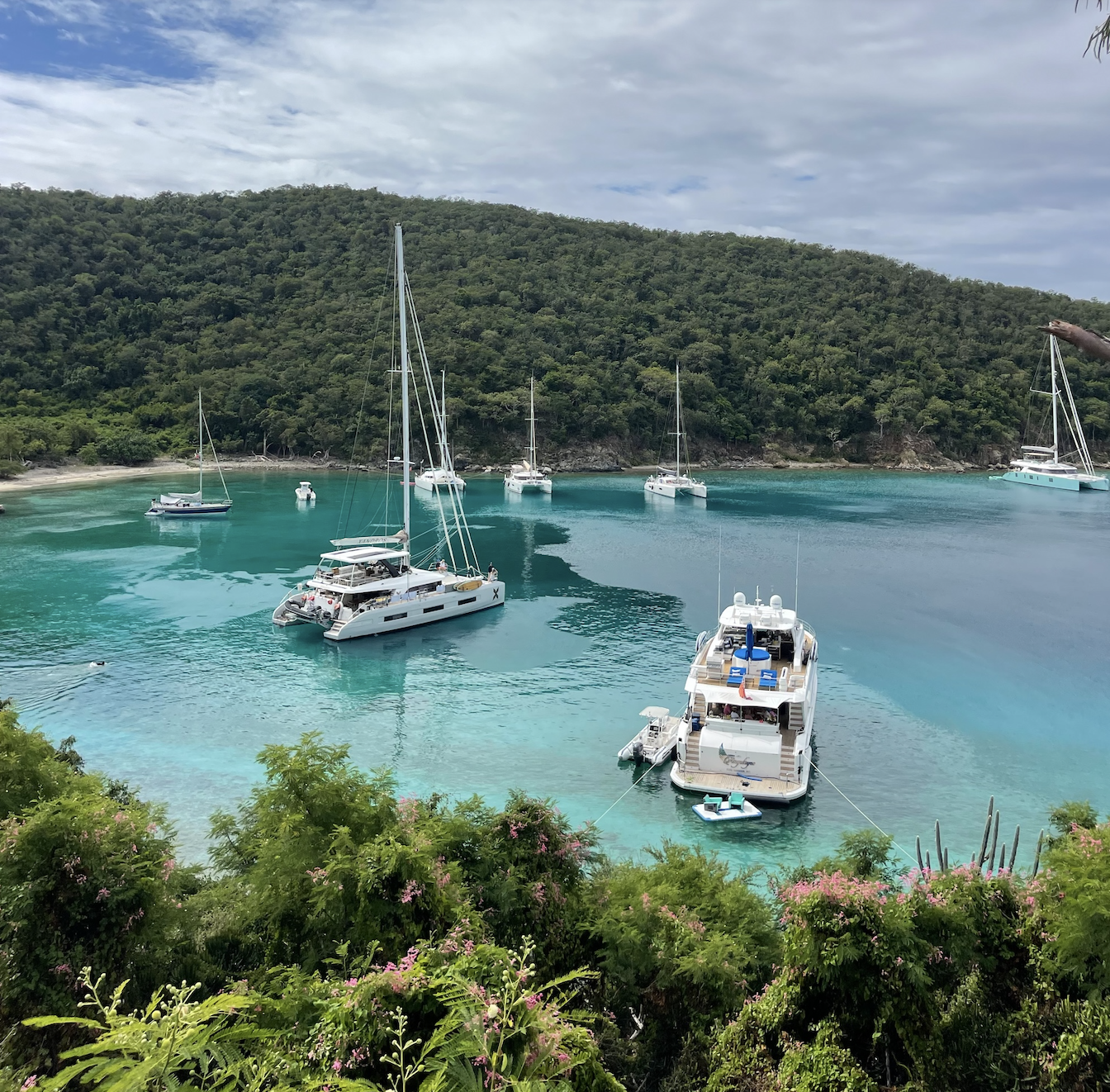 A luxury catamaran, anchored in crystal clear blue waters in the British Virgin Islands.