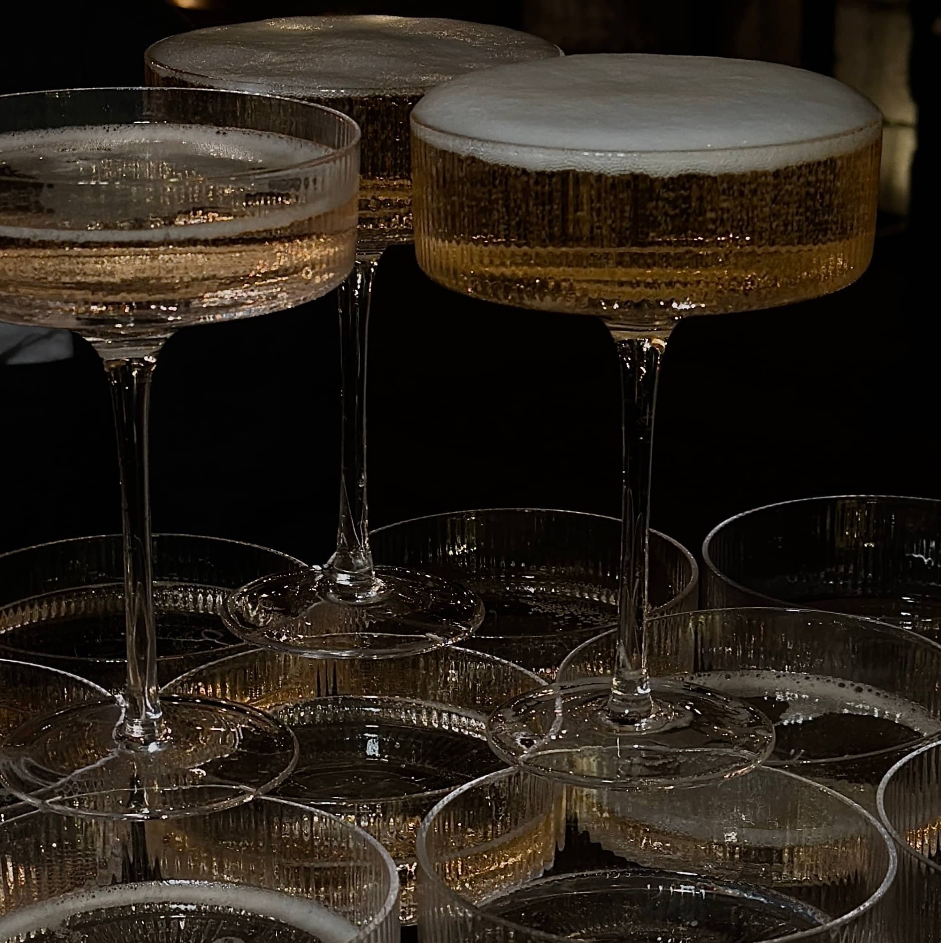 Tower of champagne glasses.