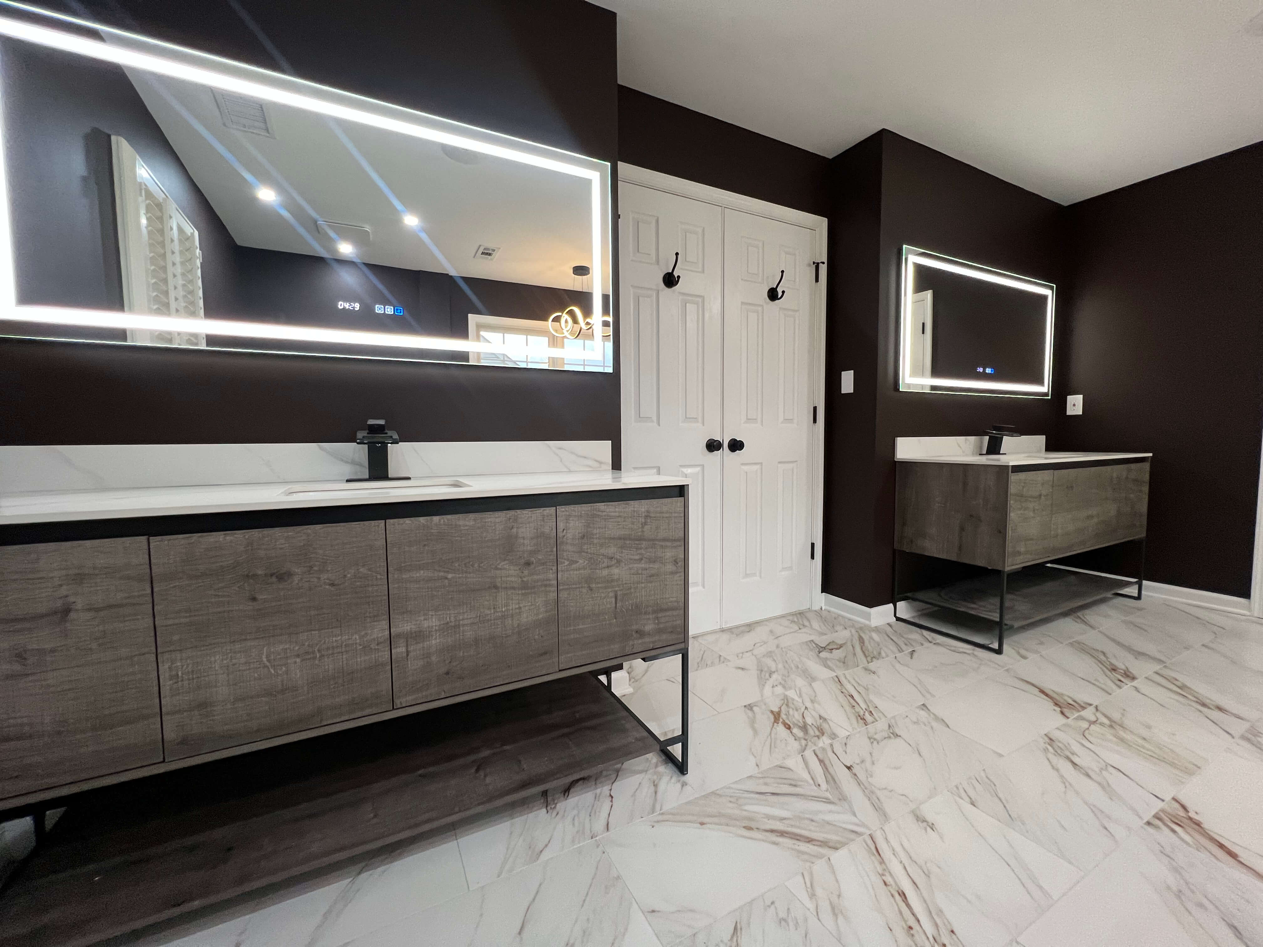 An open plan kitchen and dining area after a remodel, with an island and pendants