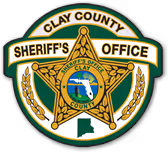 Clay County Sheriff's Office golden star-shaped badge with official emblem