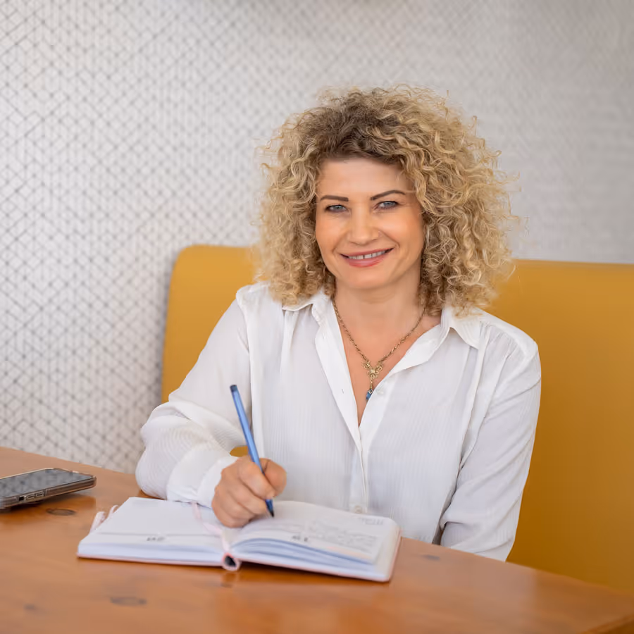 Agnes taking notes for health coaching