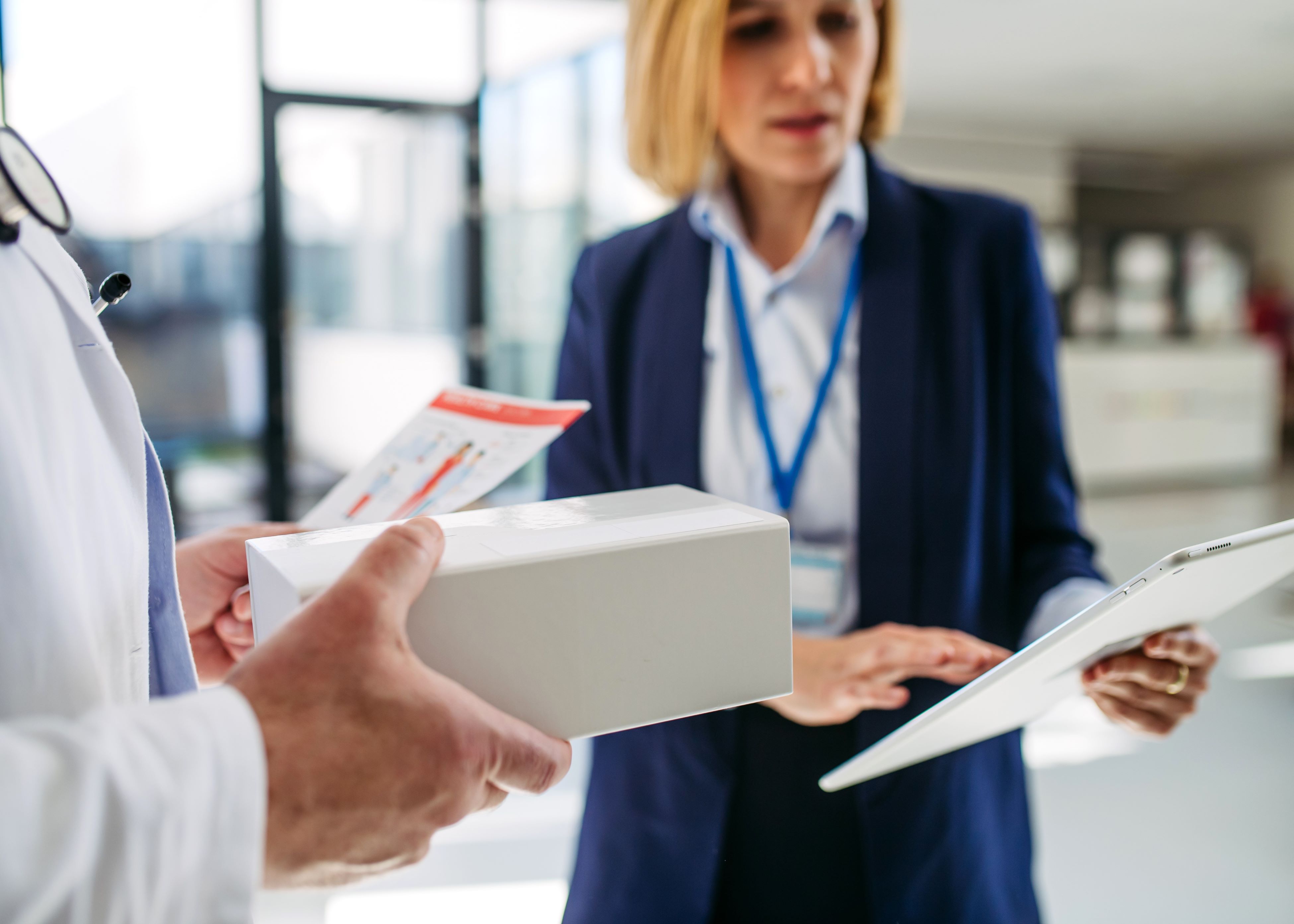 A person handing something to another person.