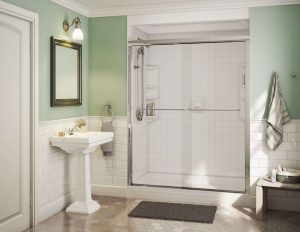 a newly remodeled bathroom with step-in shower and glass doors