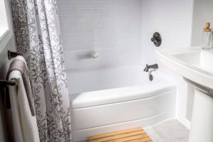 a bathing space that was converted from a shower to an elegant bathtub