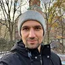 Portrait of Milos Nikolic outdoors, wearing a beanie, reflecting his adaptable approach to technical leadership.