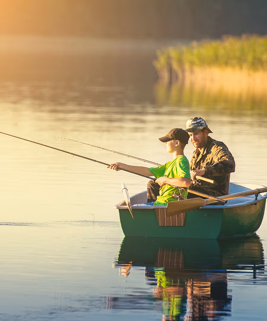 A father and son fishing in the lake
