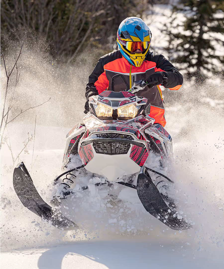 Person riding a snow mobile 