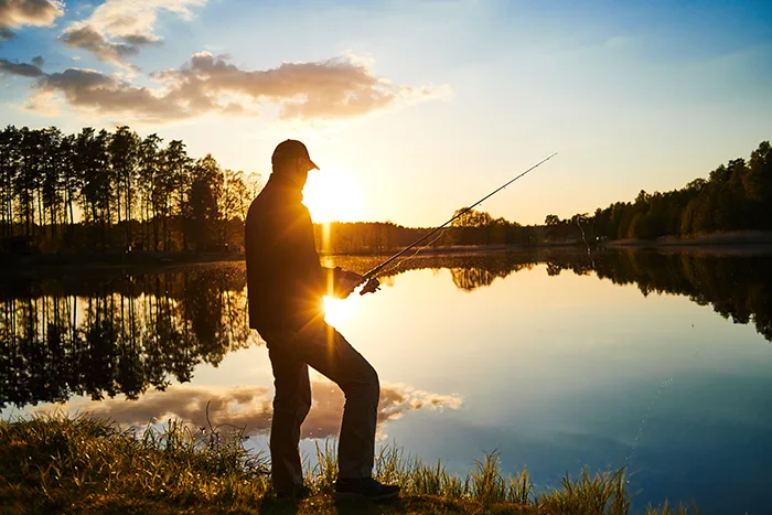 A person fishing on a lake.