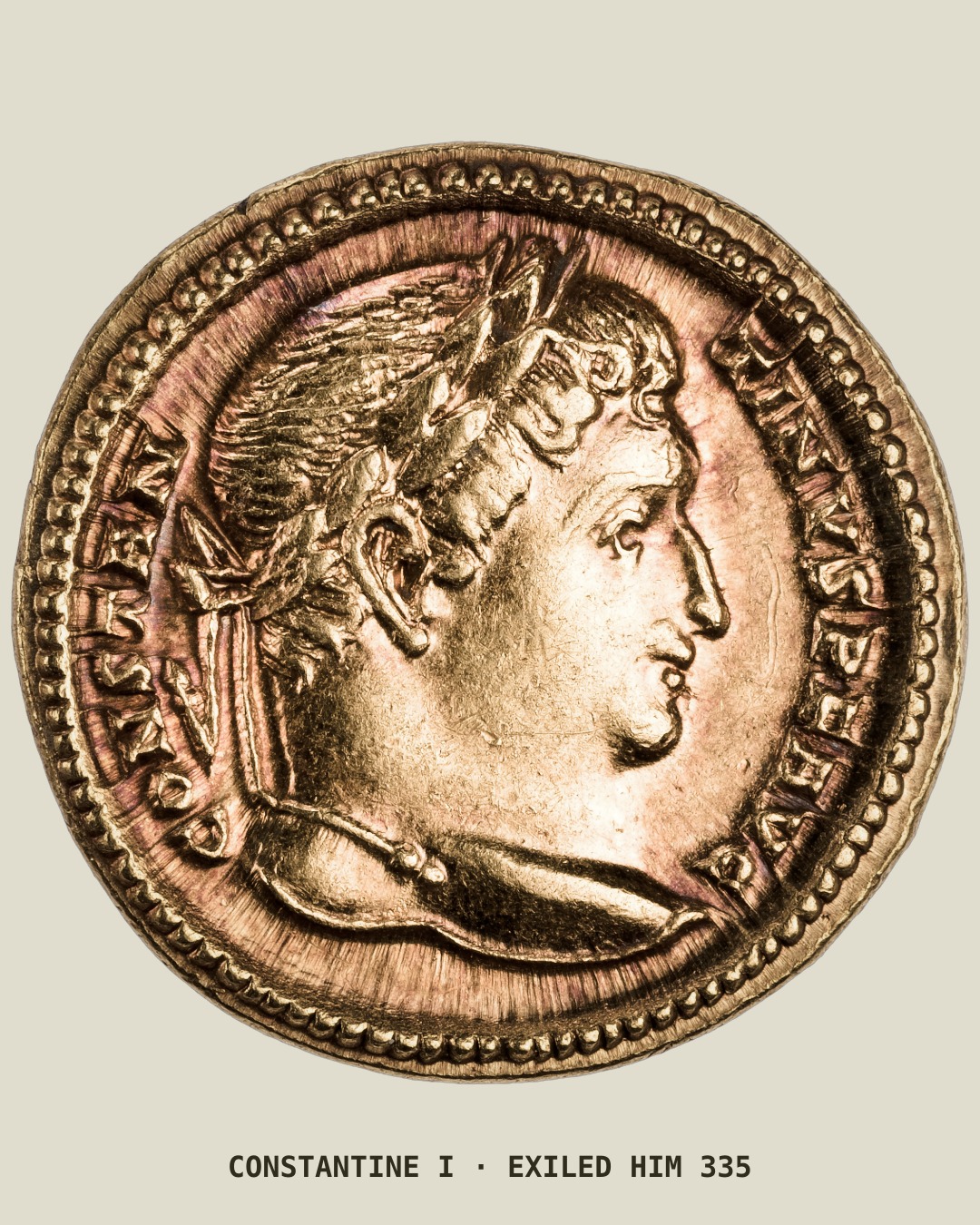 A gold coin showing the laureate head of the emperor Constantine in profile.