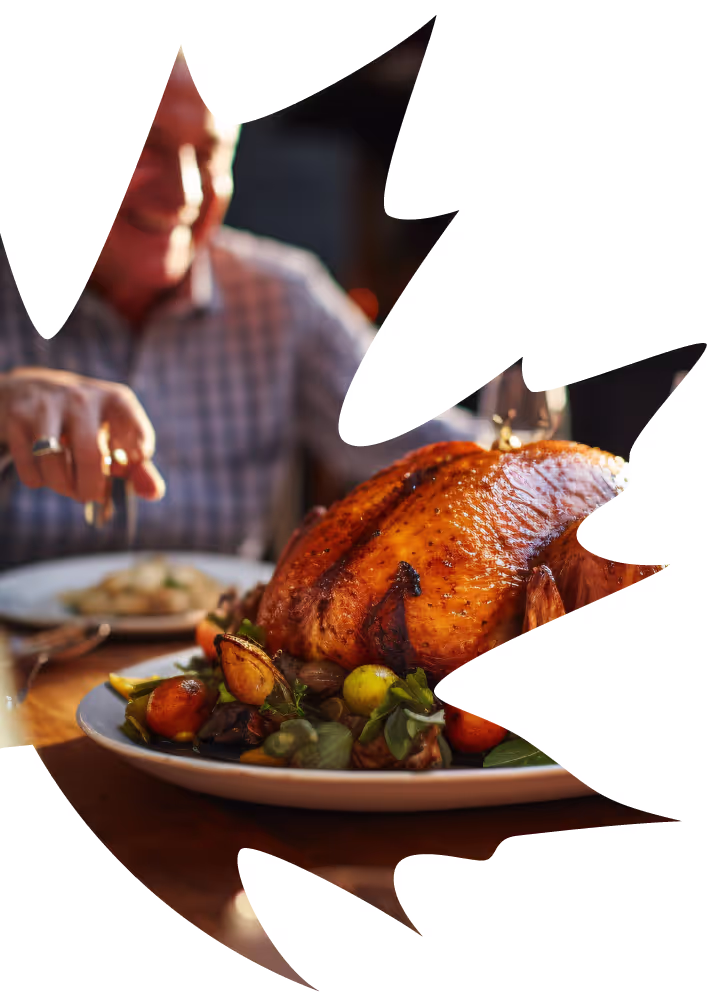 a person sitting at a table with a turkey