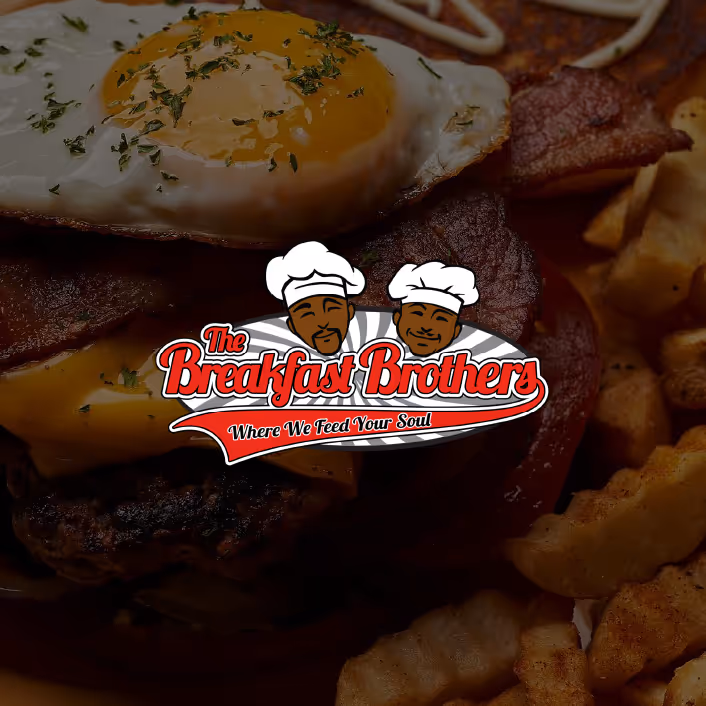 A breakfast burger with bacon and an egg on top.