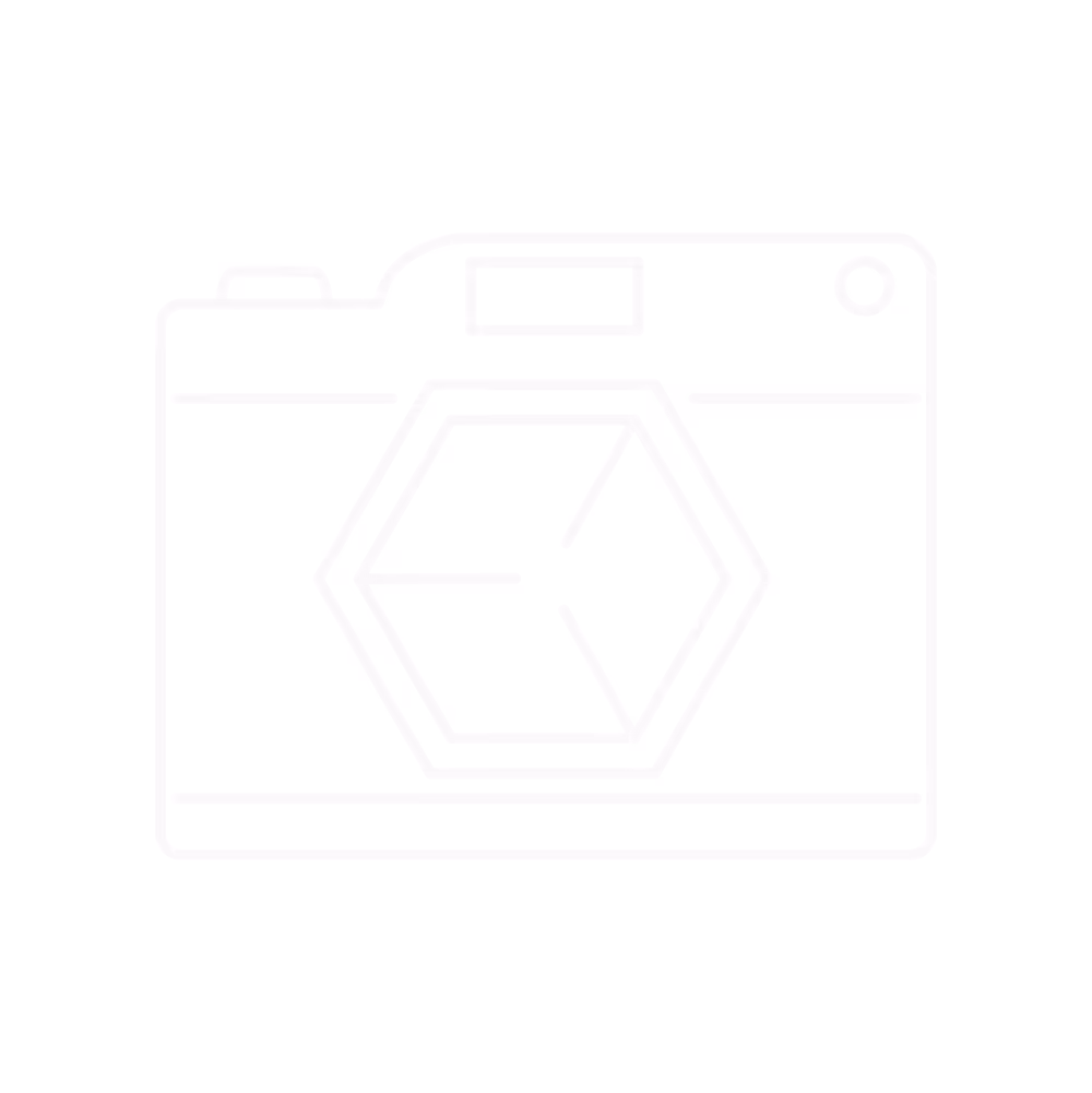 Smiling businesswoman in black suit shaking hands with male colleague over desk with laptop in modern office.