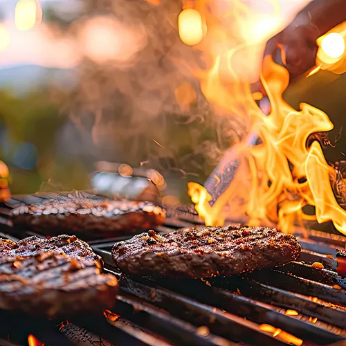 Someone grilling burgers and food. Popmenu's summer campaign 2025
