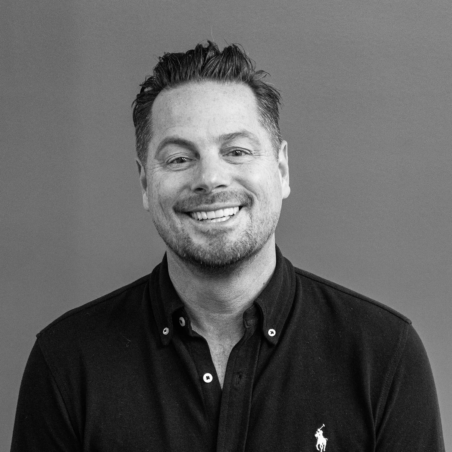 Tony Roy COO and Co-founder of Popmenu, headshot in black and white