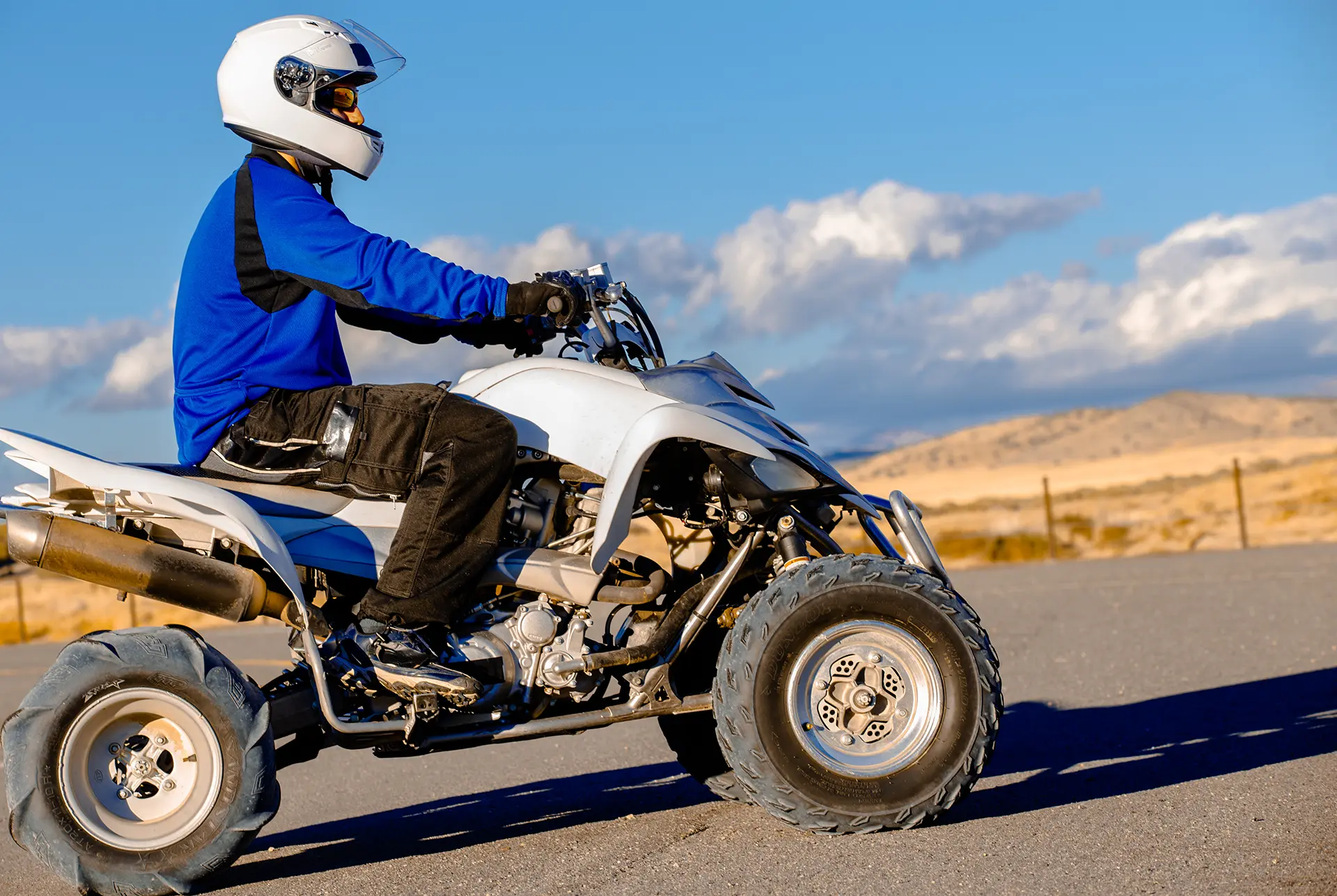 ATV rider exploring the scenic open landscapes around Midway, Utah under a clear blue sky