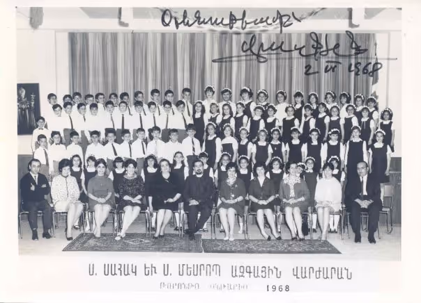 Black and white group photo of students and teachers posed in rows in front of a curtain, dated 1968 with handwritten notes.