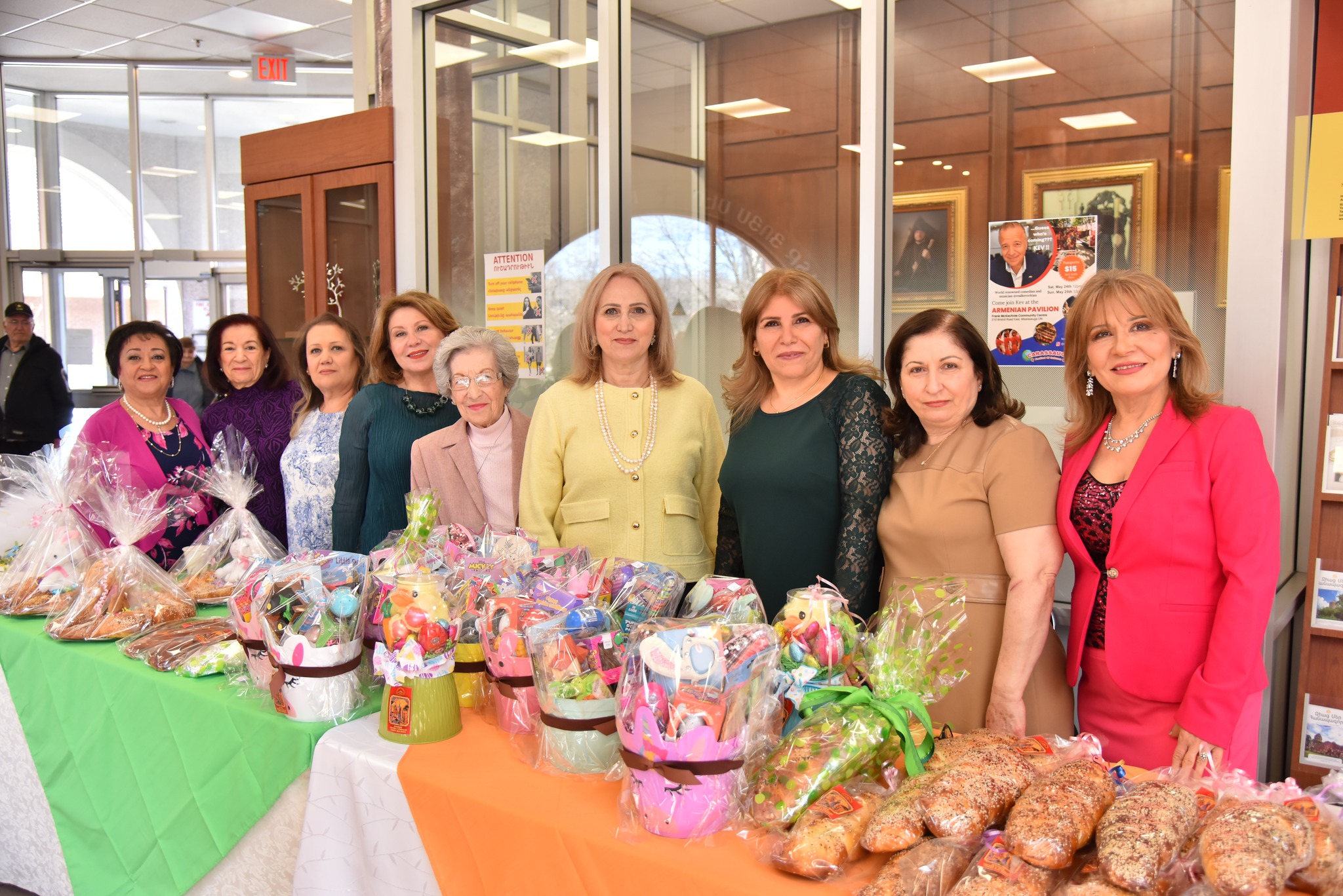 A funeral wreath of pink and white flowers with a ribbon reading “FROM VARTAN VARTANI AND FAMILY” inside Holy Trinity Armenian Church