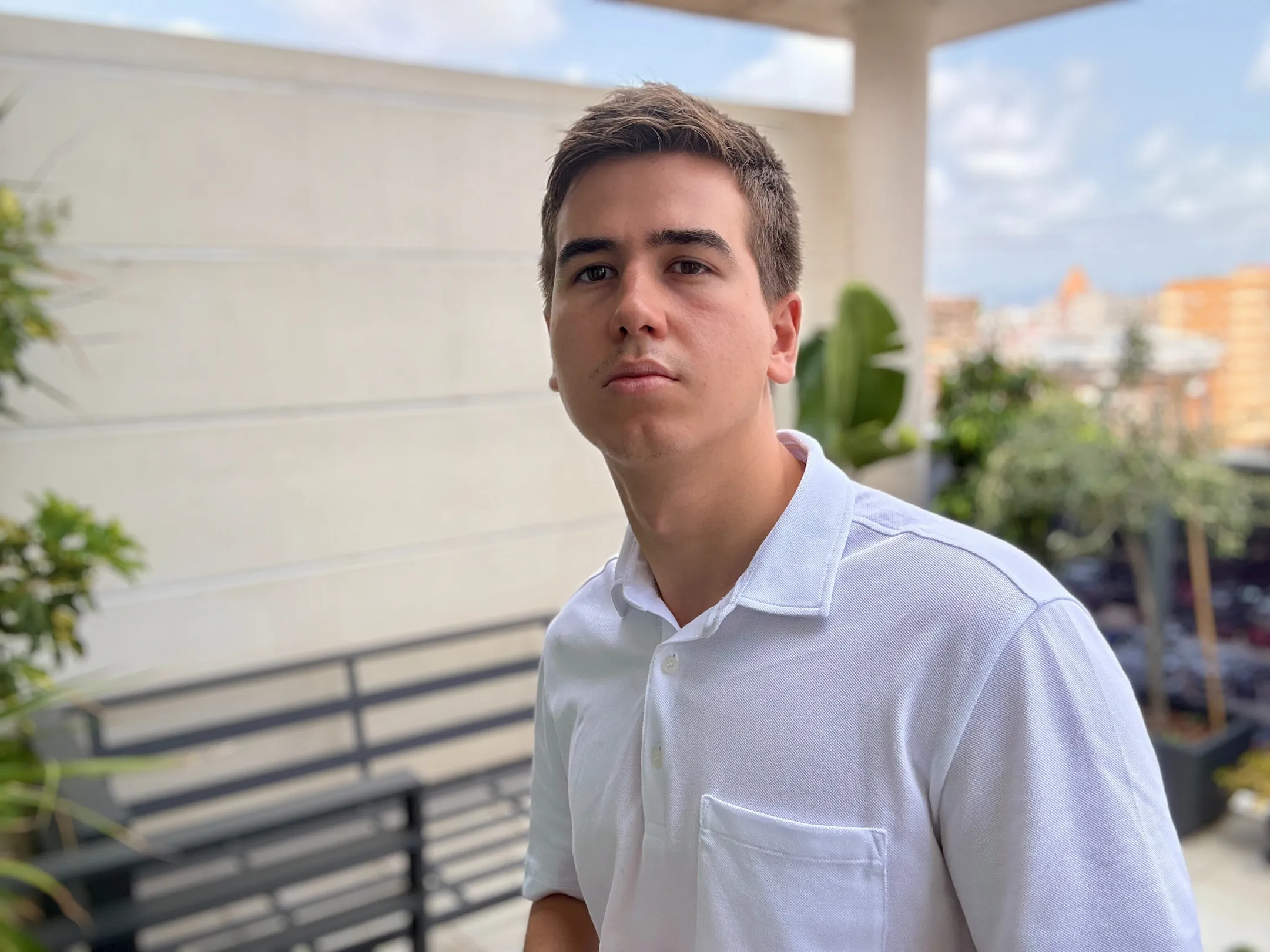 An image of Boris Vedernikov wearing a white polo