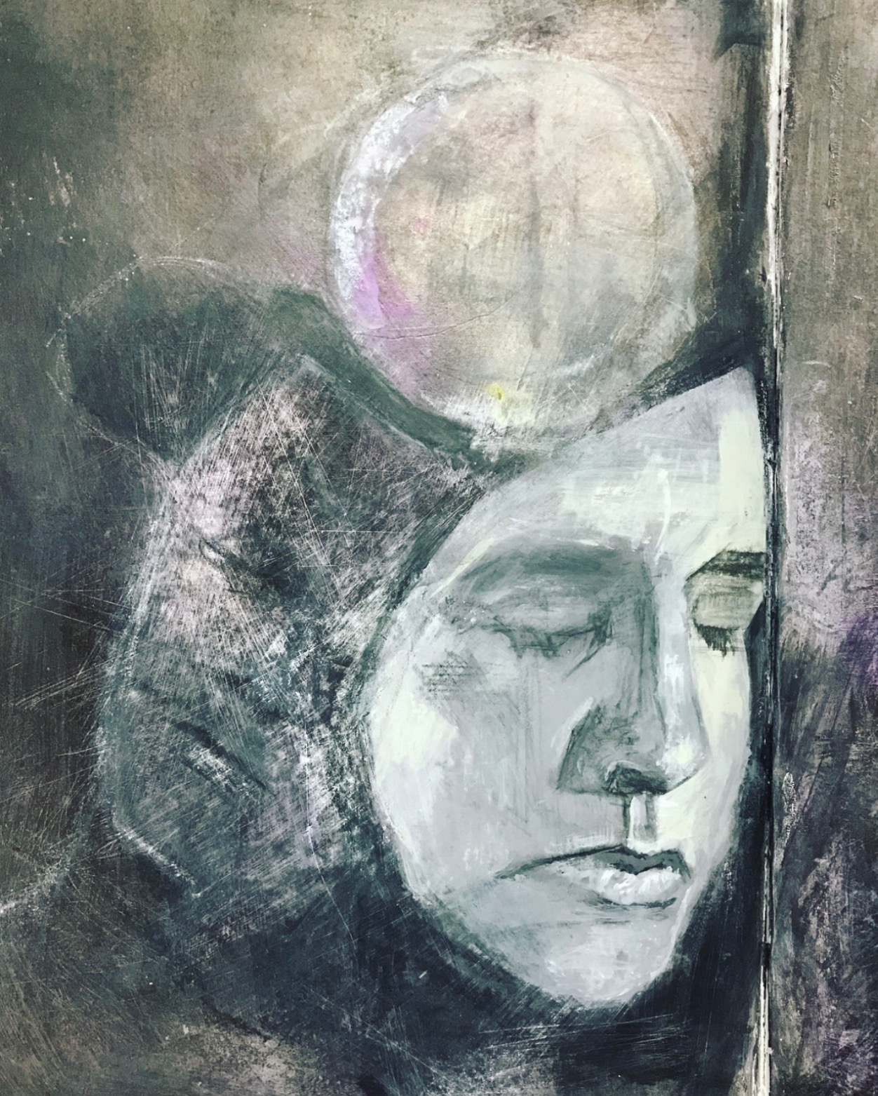 Painted prayer pages on a worktable