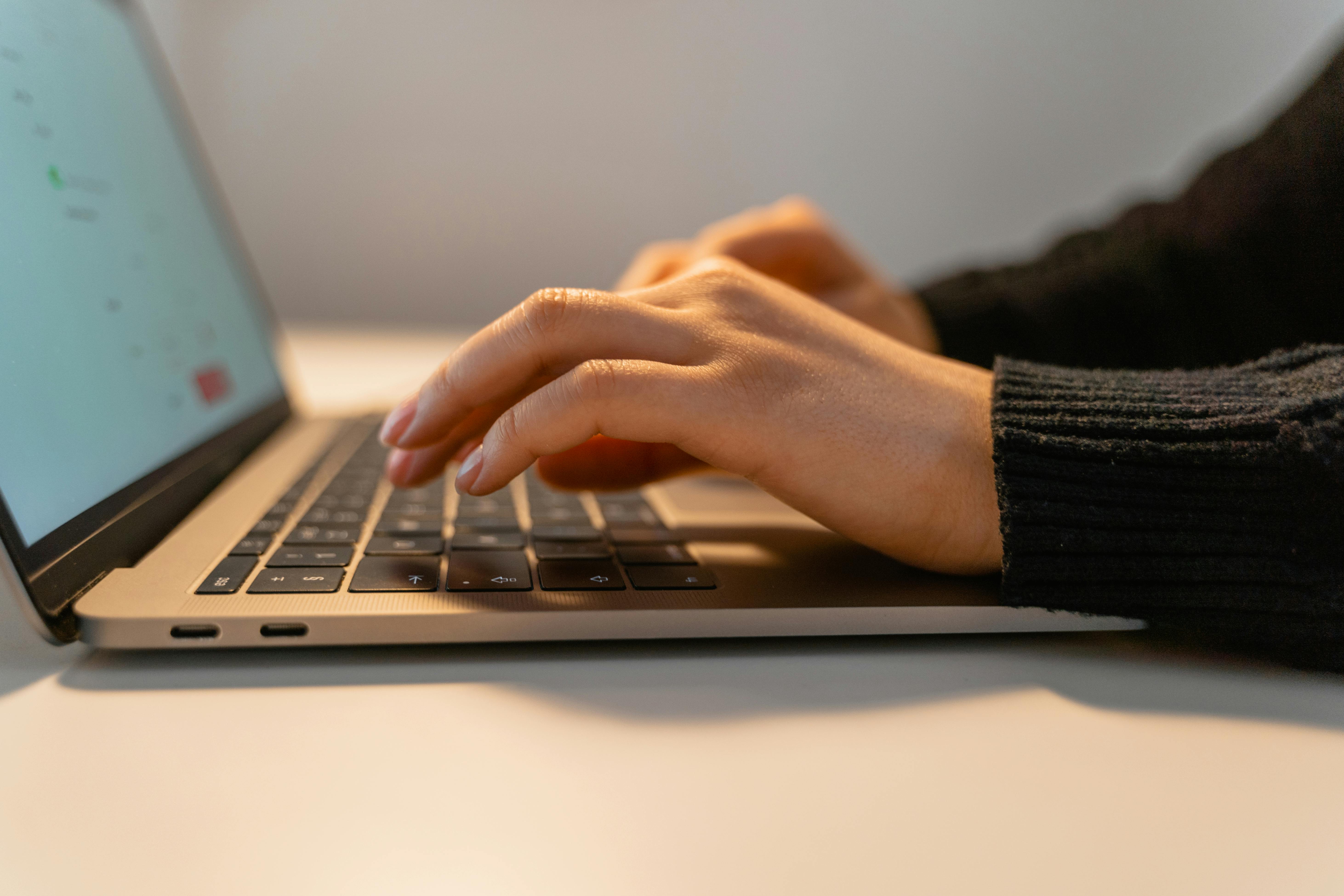 [headshot] image of satisfied student using a laptop
