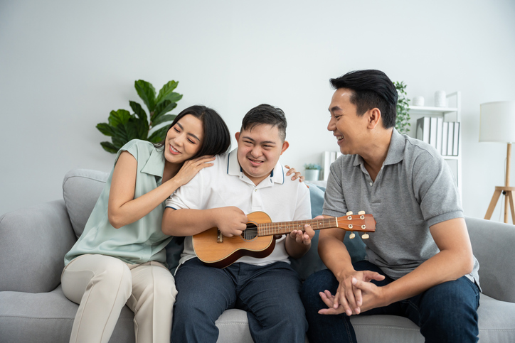 Couple with dog on couch