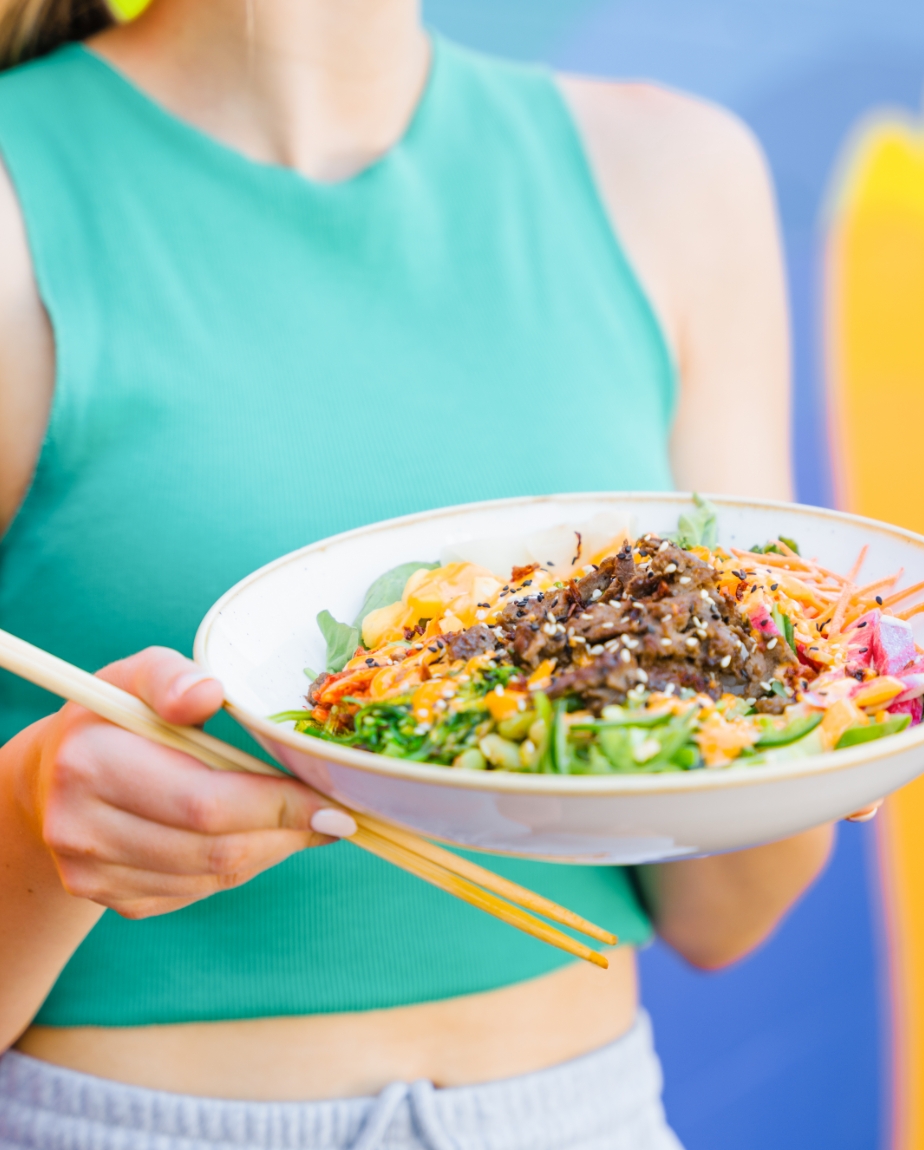 A young woman holding a delicious looking dish