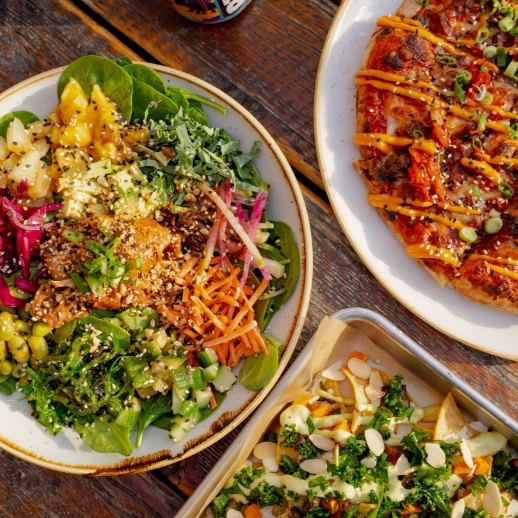 A top down photo of a variety of our colourful dishes on a table