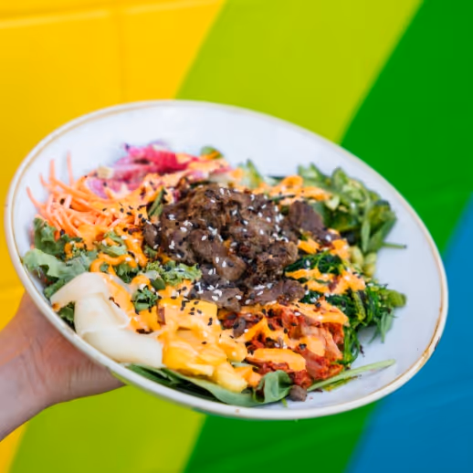 Someone holding one of our delicious bowls