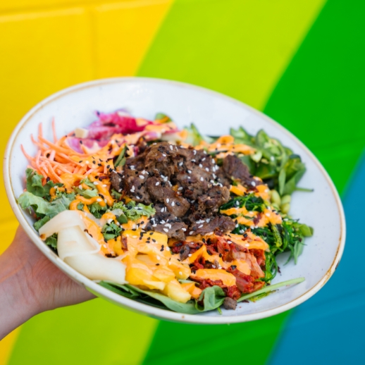 Someone holding one of our delicious bowls