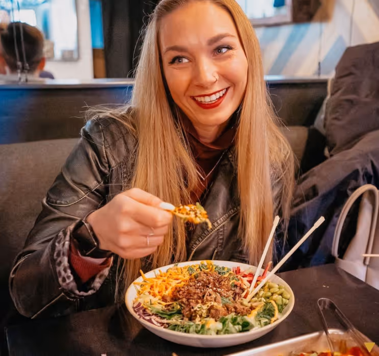 A satisfied customer indulging in some delicious nachos