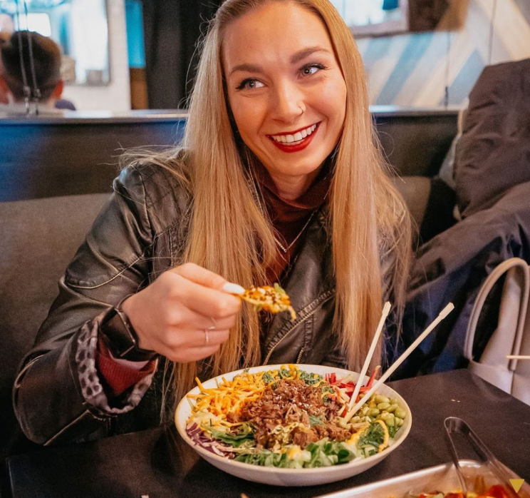 A satisfied customer indulging in some delicious nachos 