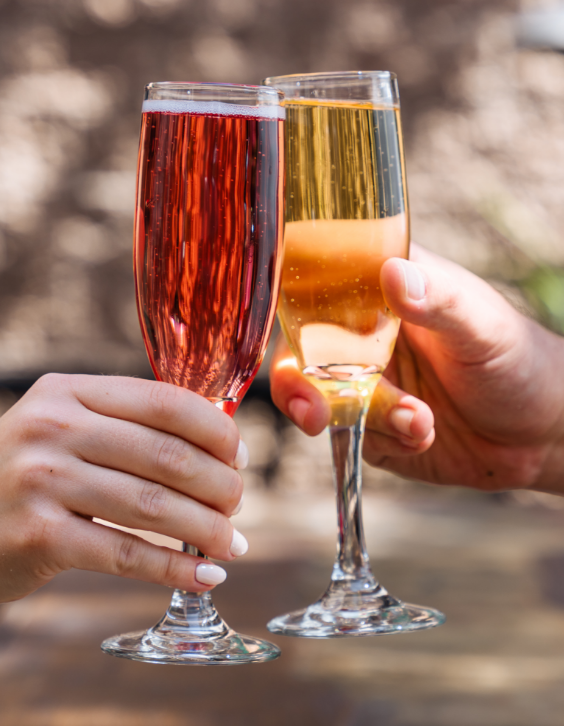 Cheers! Two people sharing cocktails together
