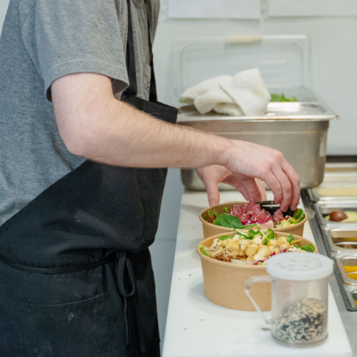 A look behind the scenes—A chef preparing a poke dish in our kitchen
