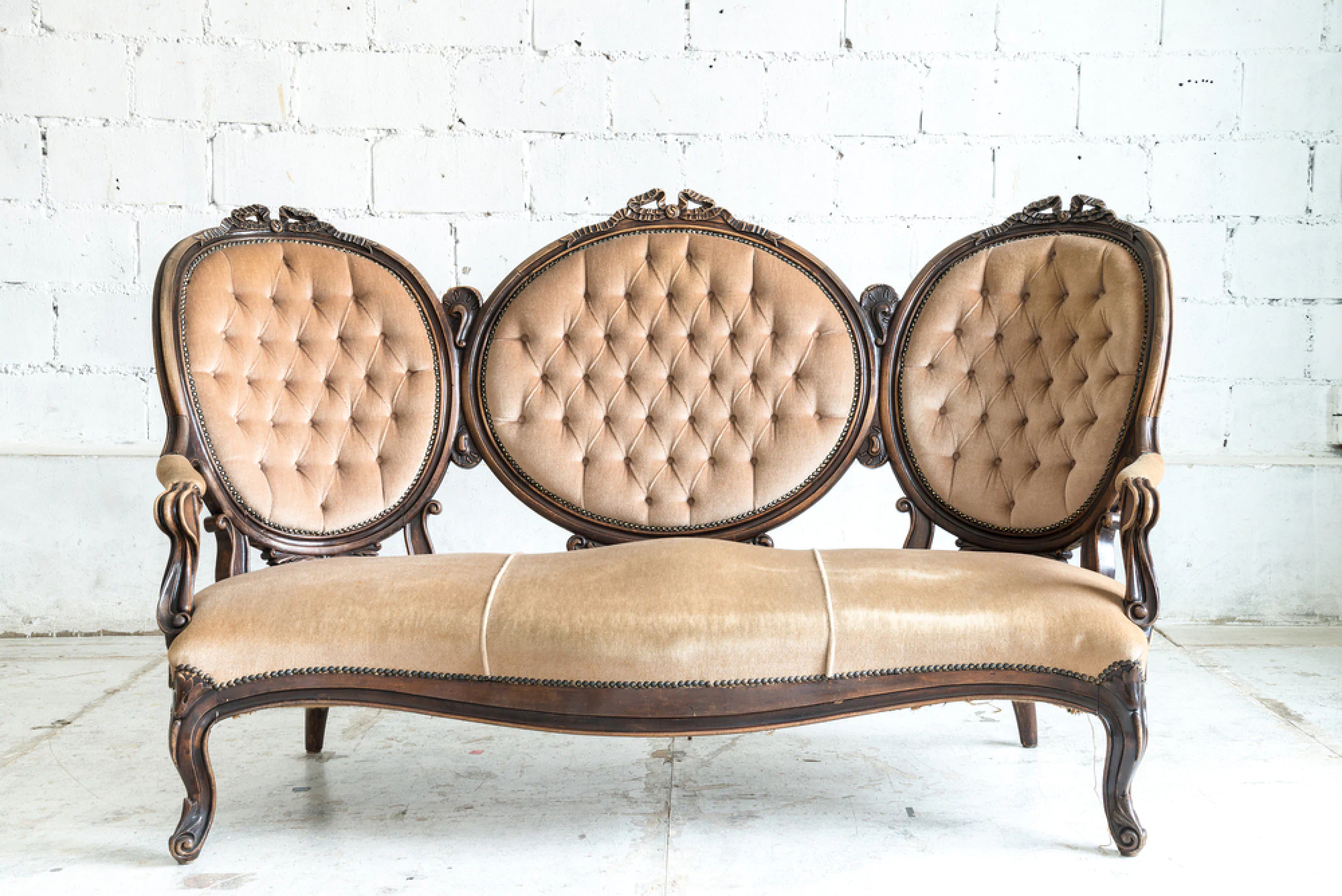 Antique leather upholstered couch