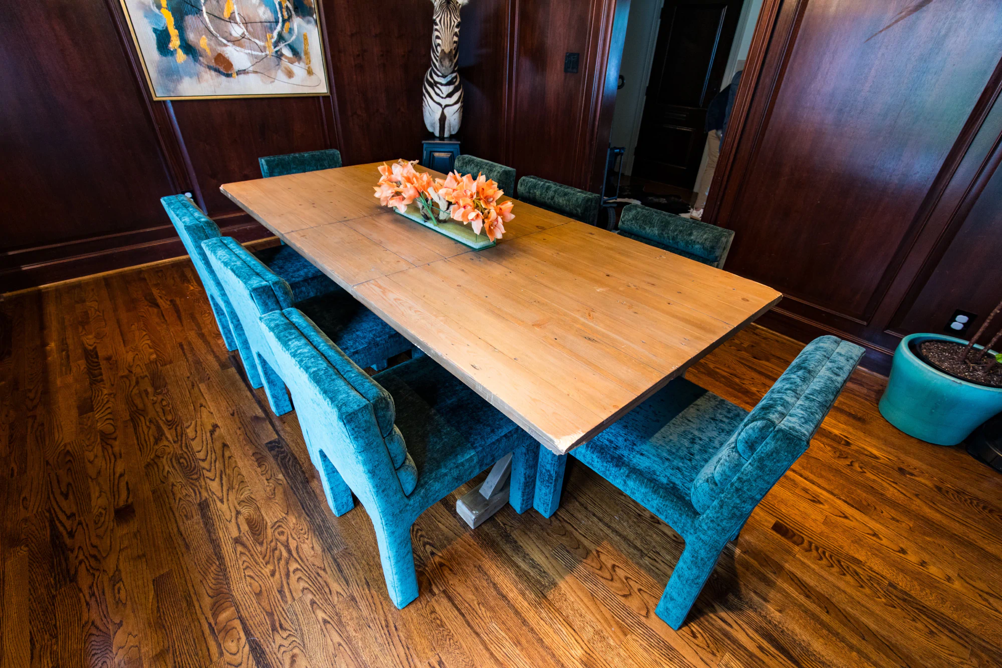 Upholstered blue chairs at dining room table