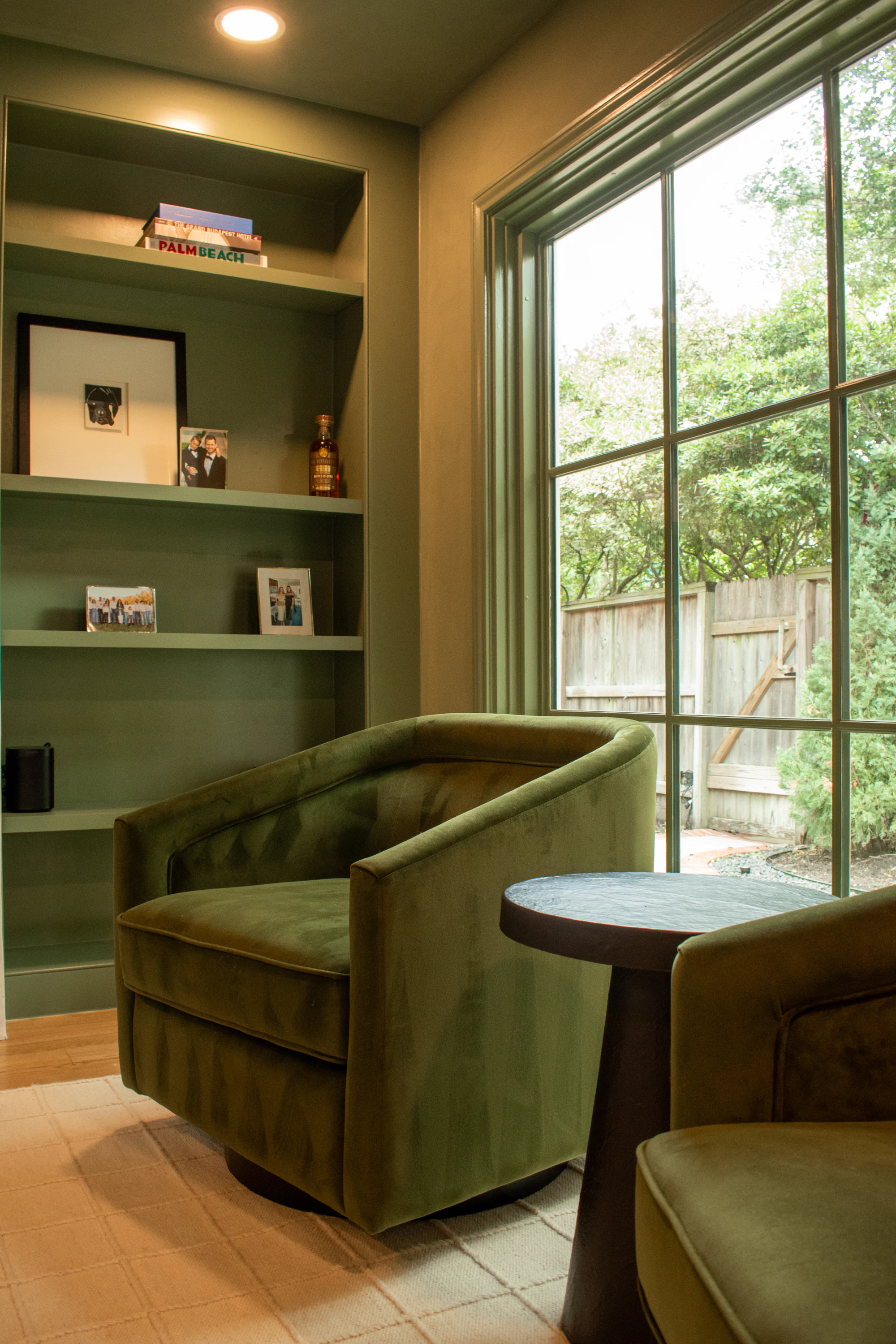 Custom green swivel arm chair by Living Designs Furniture