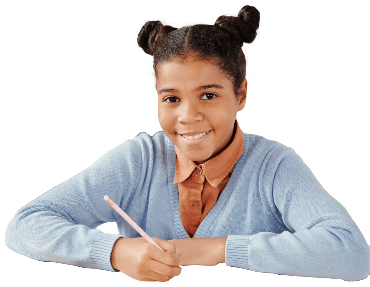Smiling student confidently using laptop at school.