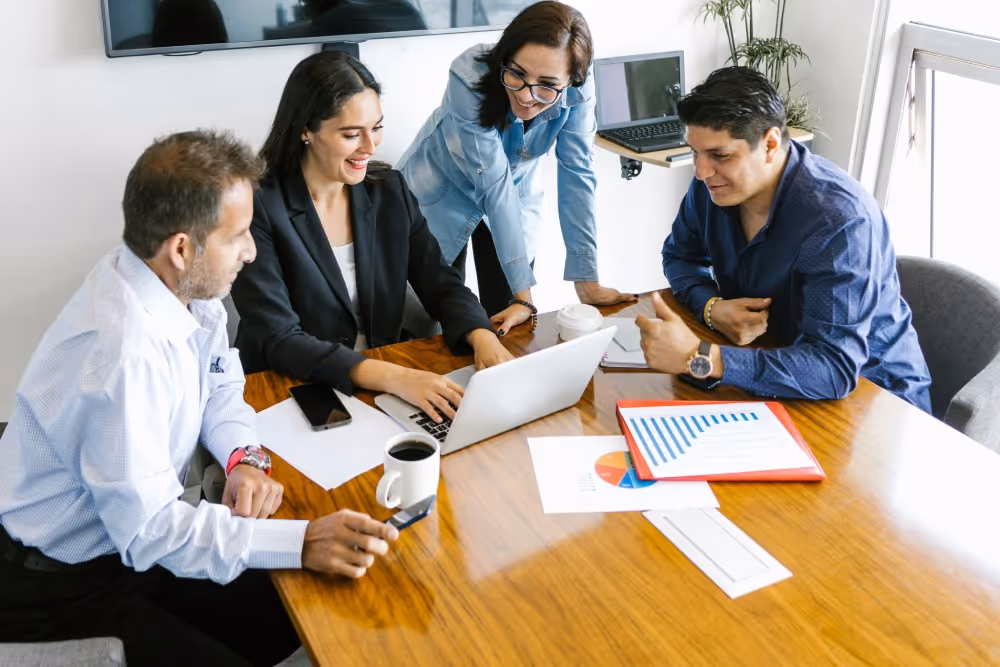 Business meeting discussing school data compliance strategy.