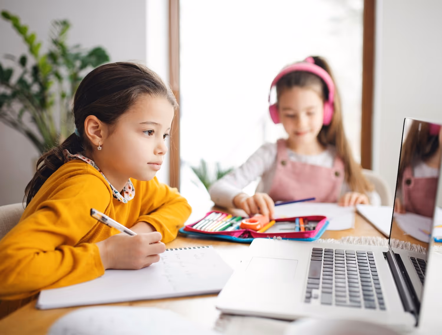 Group of children studying together in digital learning setting.