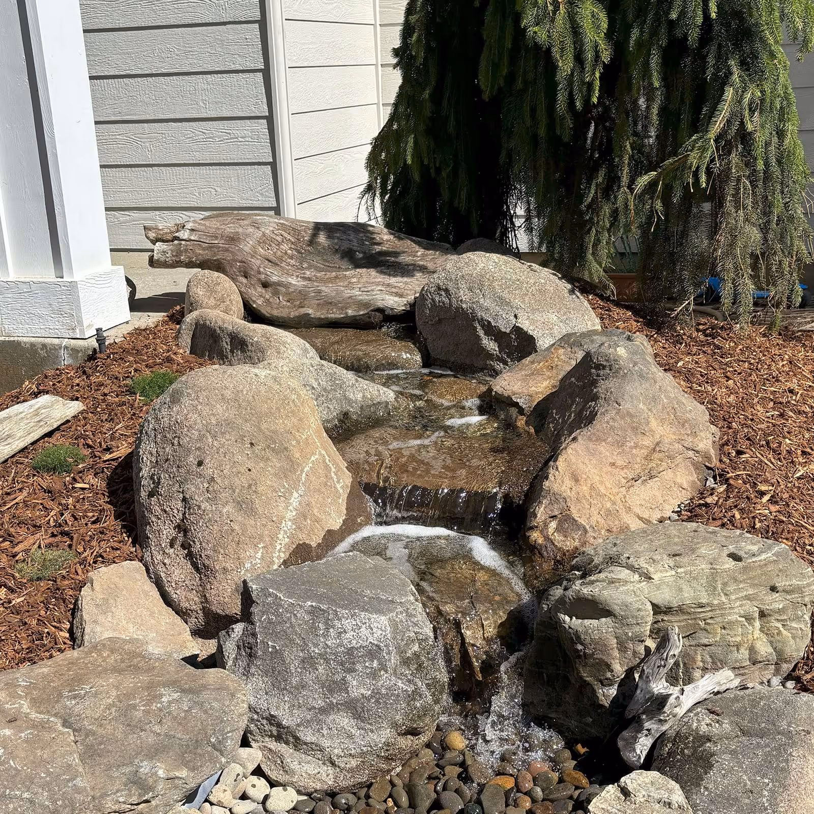Pondless waterfall feature in Spokane backyard