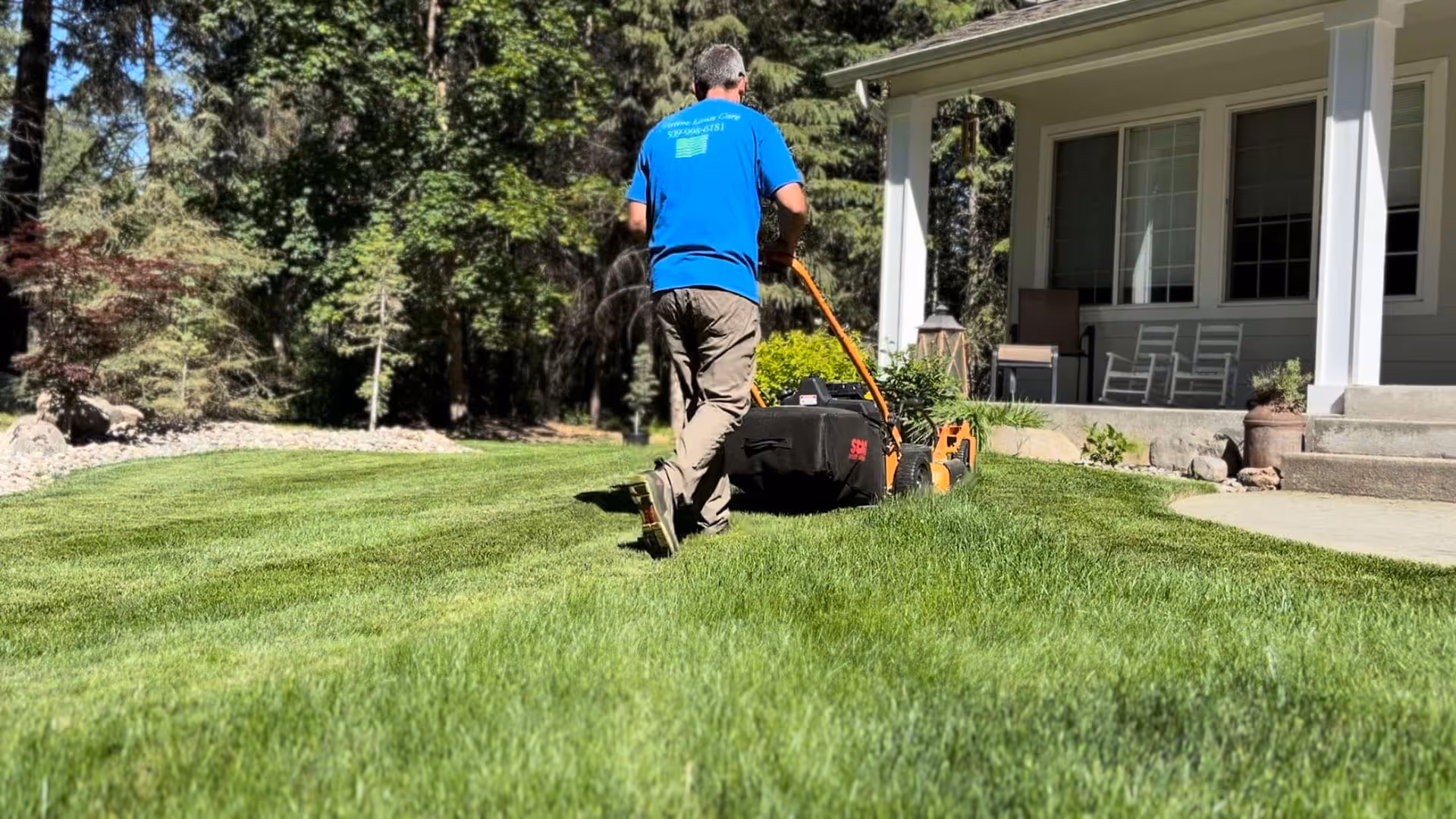 Pristine Lawn Care team mowing a neighborhood cul-de-sac
