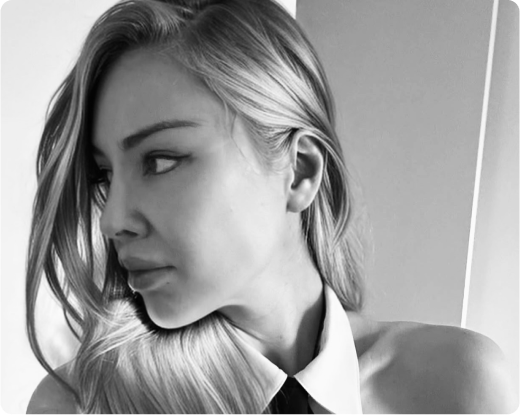 Sarah Marks in black and white looking to the side