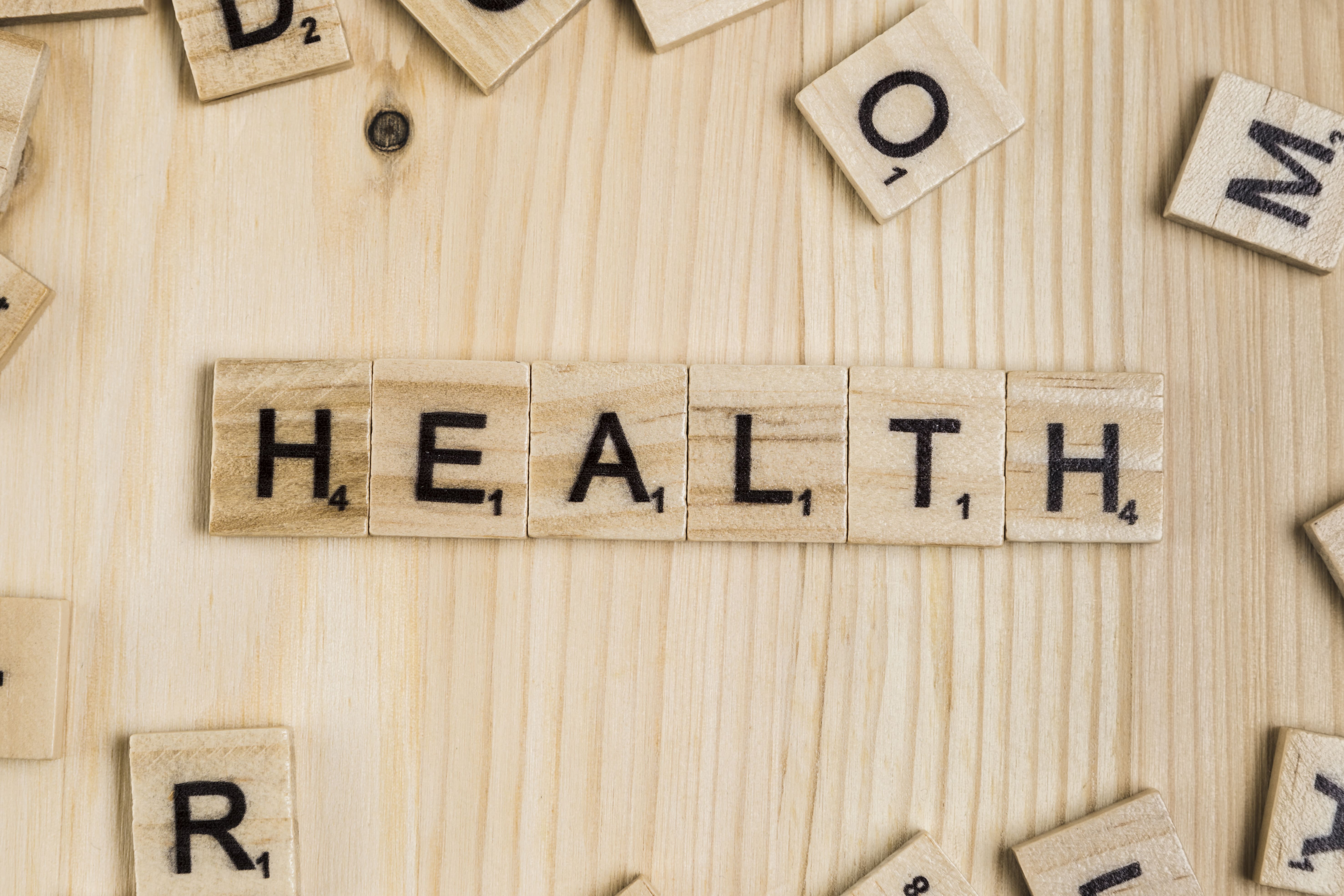 Image of the word Health spelled out with scrabble pieces - Staff Worx