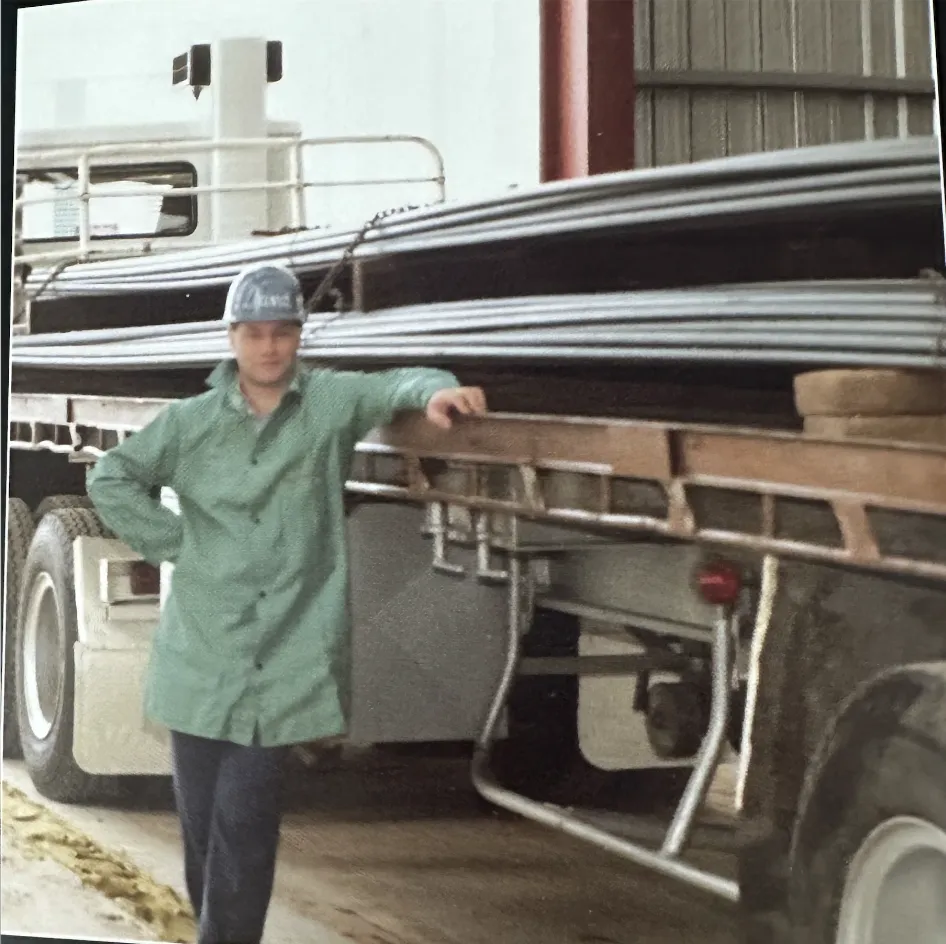 David Holckner standing next to a delivery from Smorgon Steel