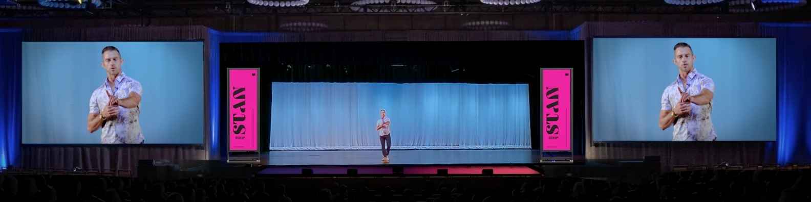 Bryan Gile on a large conference stage
