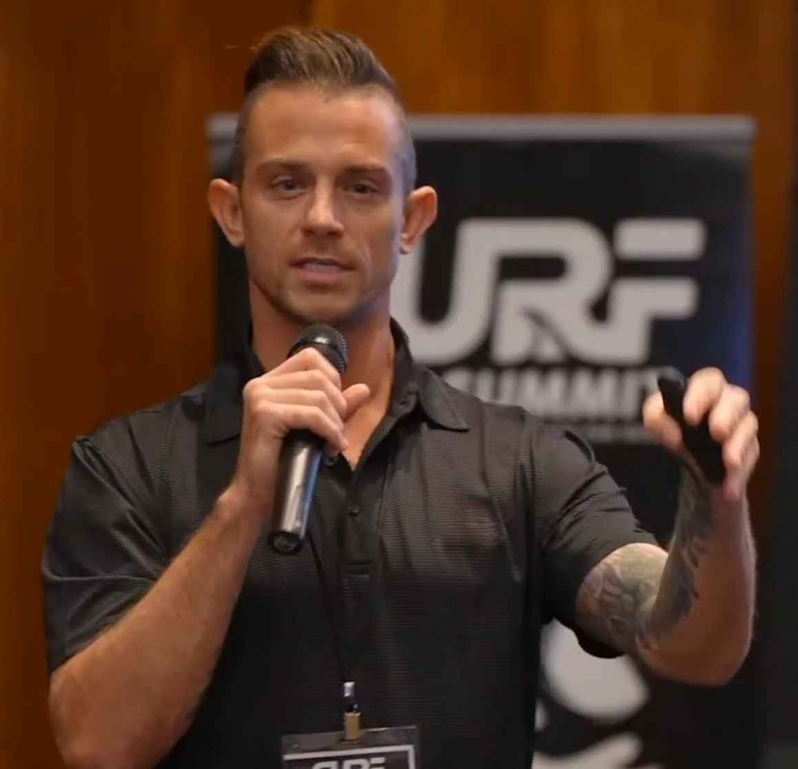 Bryan Gile speaking with a microphone